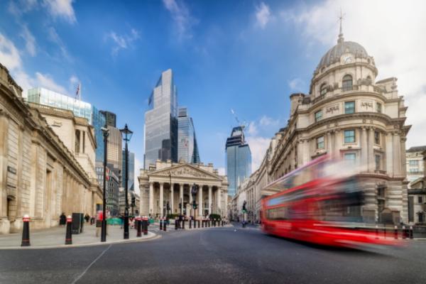 Long exposure view of the City of London with street traffic and the modern office skyscrapers in the background Long exposure view of the City of London with street traffic and the modern office skyscrapers in the background